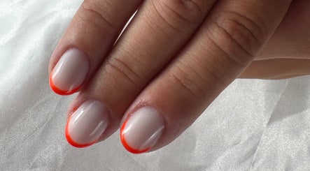 Vibrant orange-tipped nails from Nail Studio By M.C in Ombrée D'anjou, Pays De La Loire, FR.