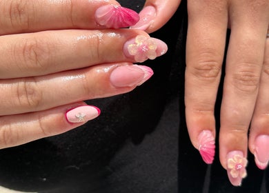 Elegant pink nail art with floral designs at Nail Studio By M.C, Ombrée D'anjou, Pays De La Loire, FR.