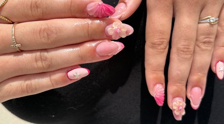 Elegant pink nail art with floral designs at Nail Studio By M.C, Ombrée D'anjou, Pays De La Loire, FR.