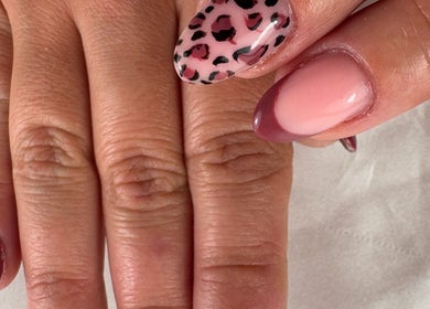 Elegant nail art at Nail Studio By M.C, Ombrée D'anjou, Pays De La Loire, FR, featuring leopard and pink designs.