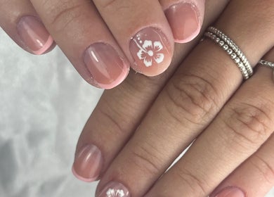 Elegant floral nail art at Nail Studio By M.C, Ombrée D'anjou, Pays De La Loire, FR. Perfect for chic styles.