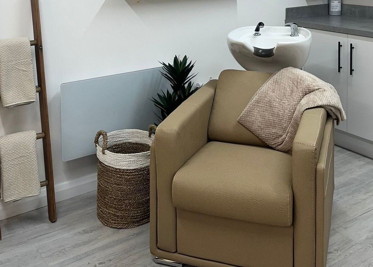 Elegant hair washing station at Grace Sadler Hair, Broughton Astley, England, GB with a modern, cozy setup.