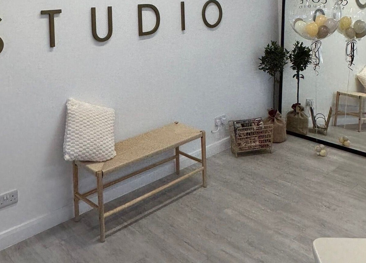 Modern studio interior at Grace Sadler Hair in Broughton Astley, England, GB. Minimalist decor with bench.