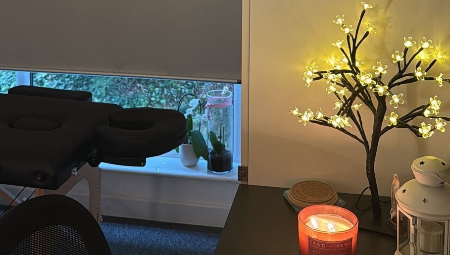 Peaceful treatment room at Mar Beauty, Canterbury, England, GB with ambient lighting and a cozy massage table.