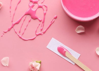 Pink wax and rose petals at The Body Bar, Warrington, England, GB. Aesthetic beauty essentials.