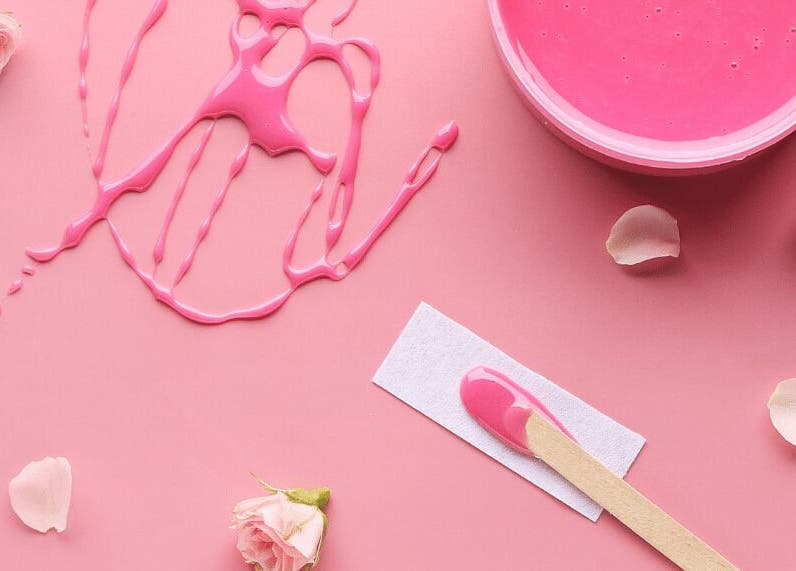 Pink wax and rose petals at The Body Bar, Warrington, England, GB. Aesthetic beauty essentials.