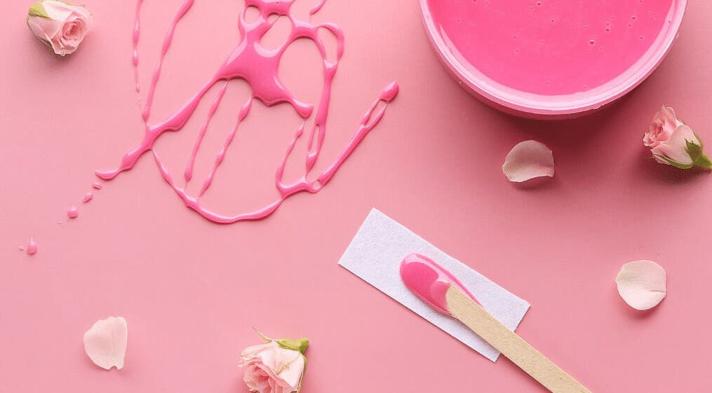 Pink wax and rose petals at The Body Bar, Warrington, England, GB. Aesthetic beauty essentials.