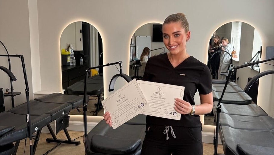 ByRemmie_ professional showing certificates in stylish salon, Scarisbrick, England, GB.