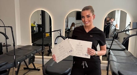 ByRemmie_ professional showing certificates in stylish salon, Scarisbrick, England, GB.