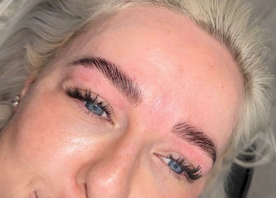 Close-up of perfected eyebrows at ByRemmie_, Scarisbrick, England, GB. Showcases expert brow styling results.