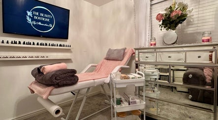 The Beauty Boutique's serene treatment room in Plymouth, England, GB showcases elegance and comfort.