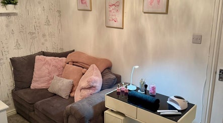 Chic and cozy corner at The Beauty Boutique, Plymouth, England, GB with plush sofa and nail station.