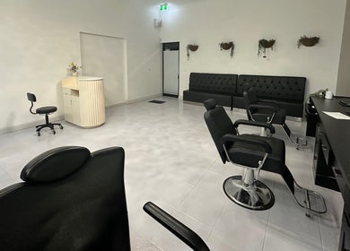Spacious interior of iBrow & Lashes Studio, Queanbeyan, New South Wales, AU with styling chairs and minimalist decor.
