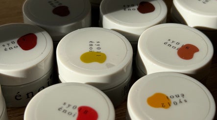 Colorful nail polish caps at mitts nails, Edinburgh, Scotland, GB showcasing vibrant hues.