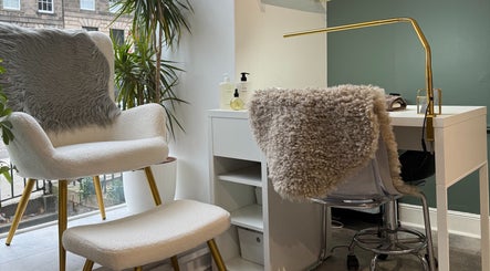 A relaxing nail station at Mitts Nails in Edinburgh, Scotland, GB with plush seating and modern decor.