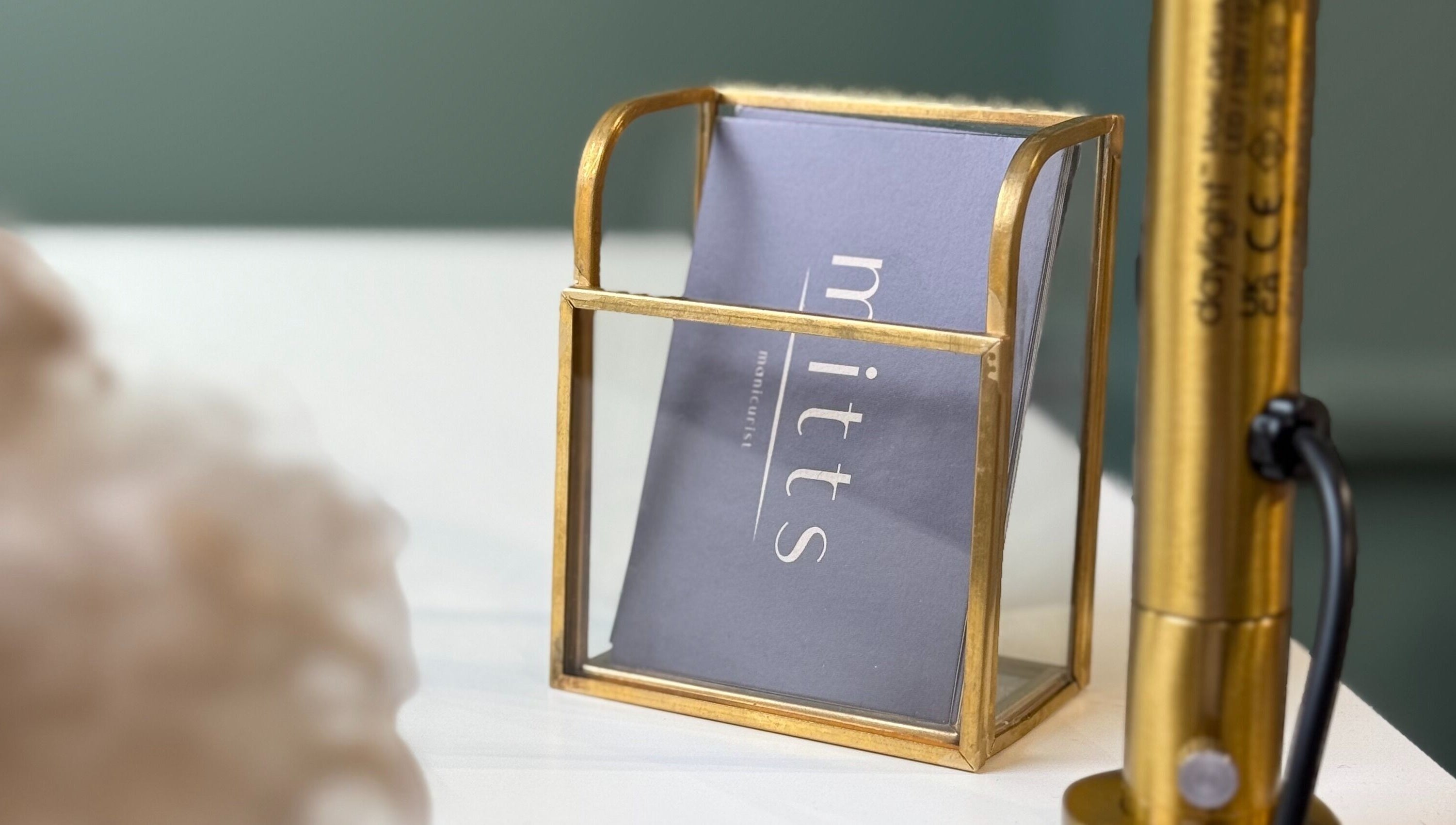 Chic cardholder at Mitts Nails, Edinburgh, Scotland, GB showcasing sleek design and luxury.