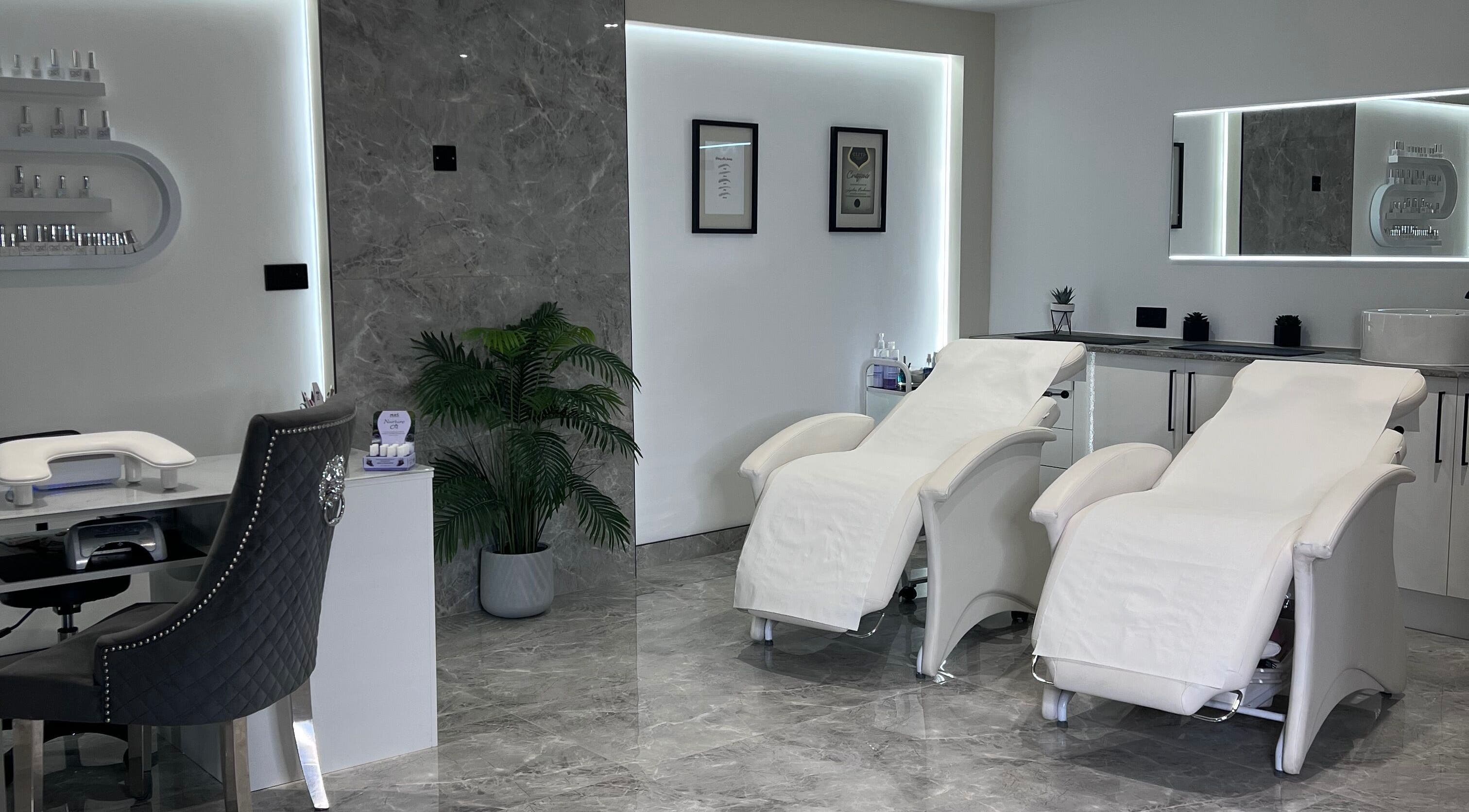 Luxurious treatment room at Beauty Expert Salon & Training, Dennyloanhead, Scotland, GB. Elegant chairs and decor.