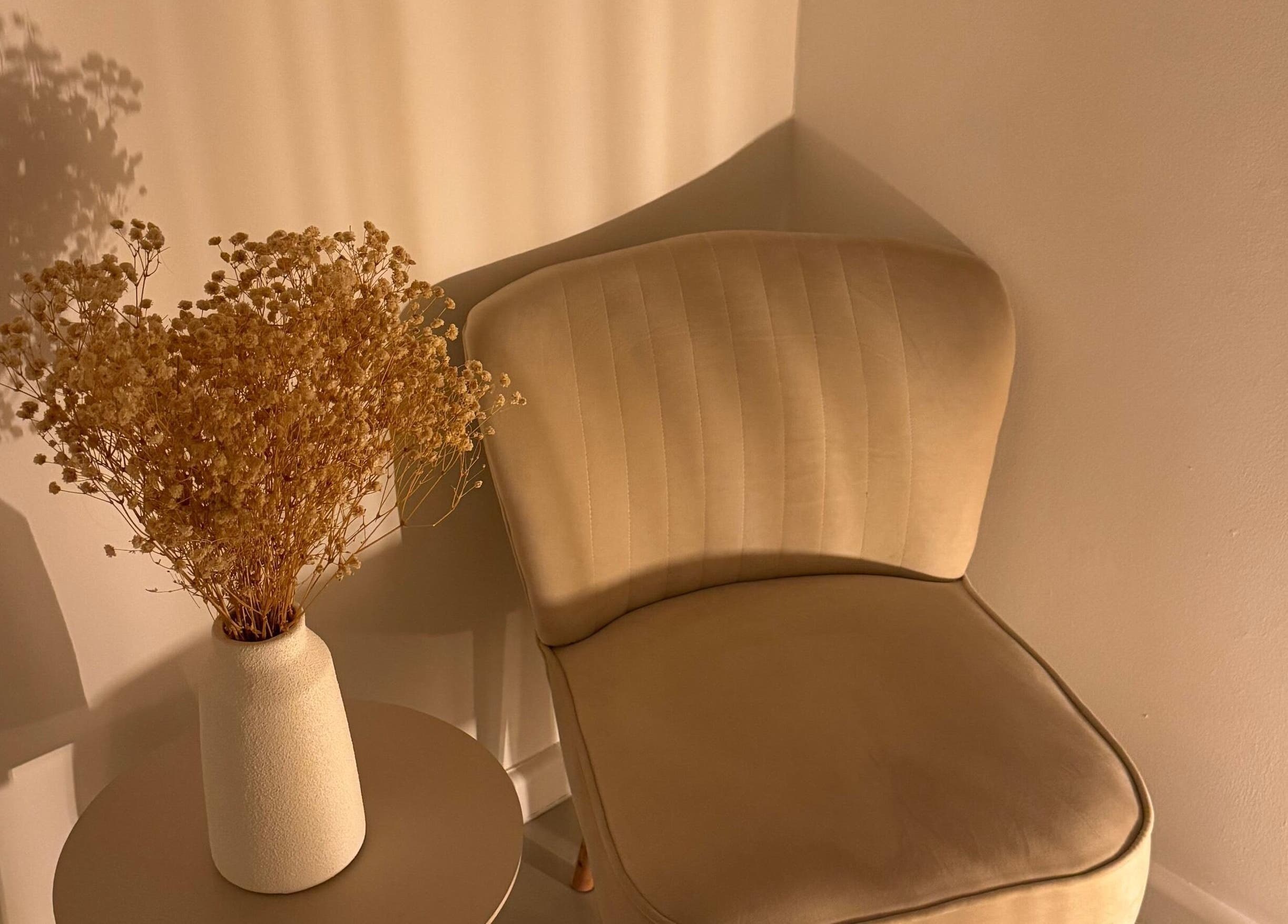 Elegant seating area with dried flowers at Skincare By Elena, Cape Town, Western Cape, ZA.