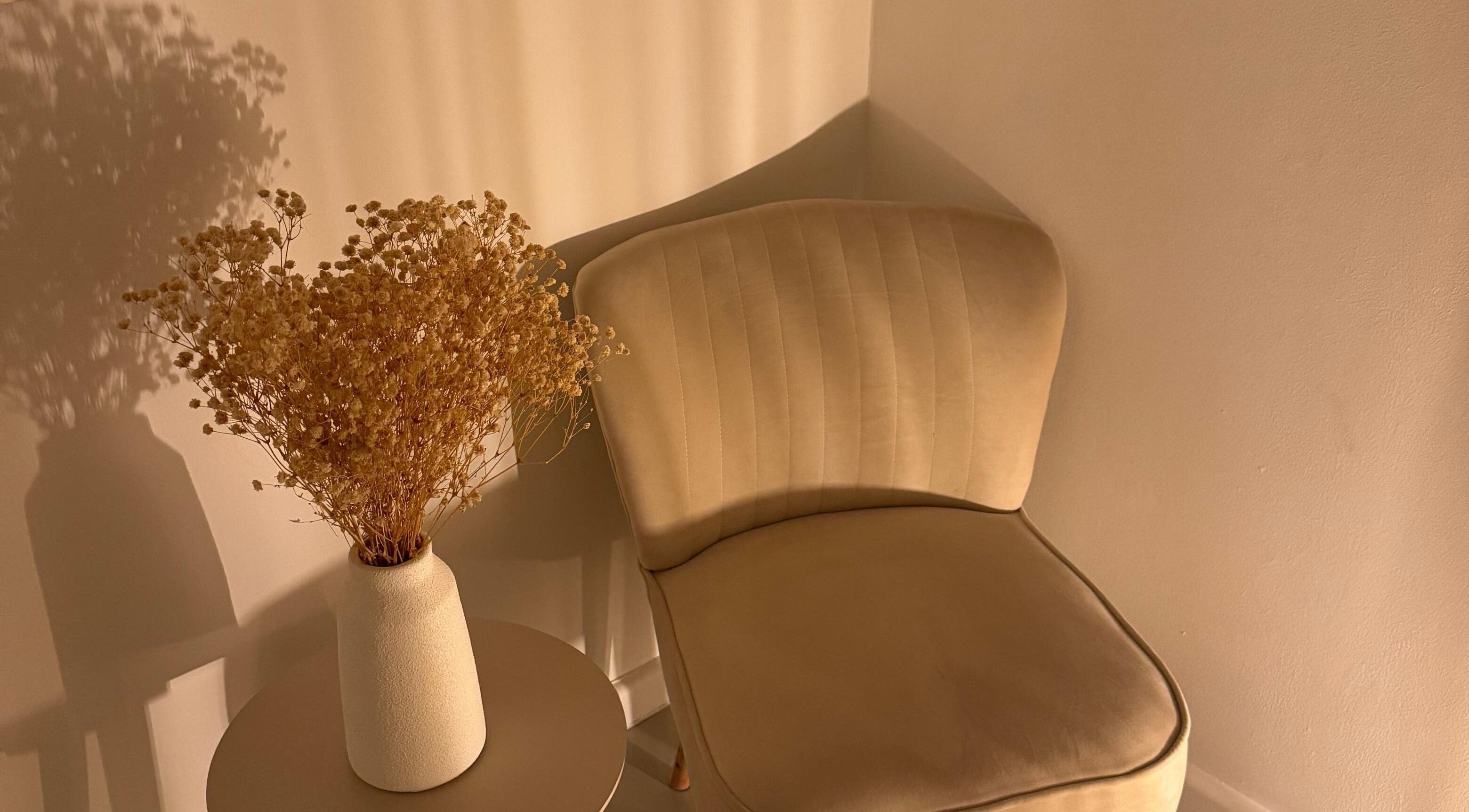 Elegant seating area with dried flowers at Skincare By Elena, Cape Town, Western Cape, ZA.