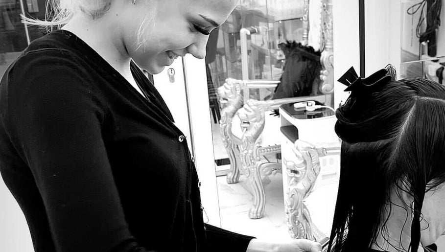 Stylist at Abi Forrester Hair - Mobile creating sleek hairstyle in London, England, GB.