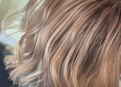 Elegant blonde waves styled by Abi Forrester Hair - Mobile in London, England, GB.