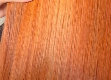 Smooth, vibrant copper hair showcased by Abi Forrester Hair - Mobile, London, England, GB.