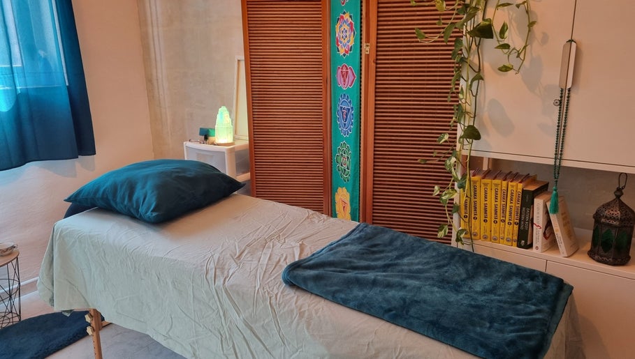 Tranquil massage room at Ray Healing Center, Ta' Xbiex, MT, featuring a treatment bed and calming decor.