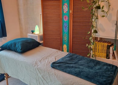 Tranquil massage room at Ray Healing Center, Ta' Xbiex, MT, featuring a treatment bed and calming decor.