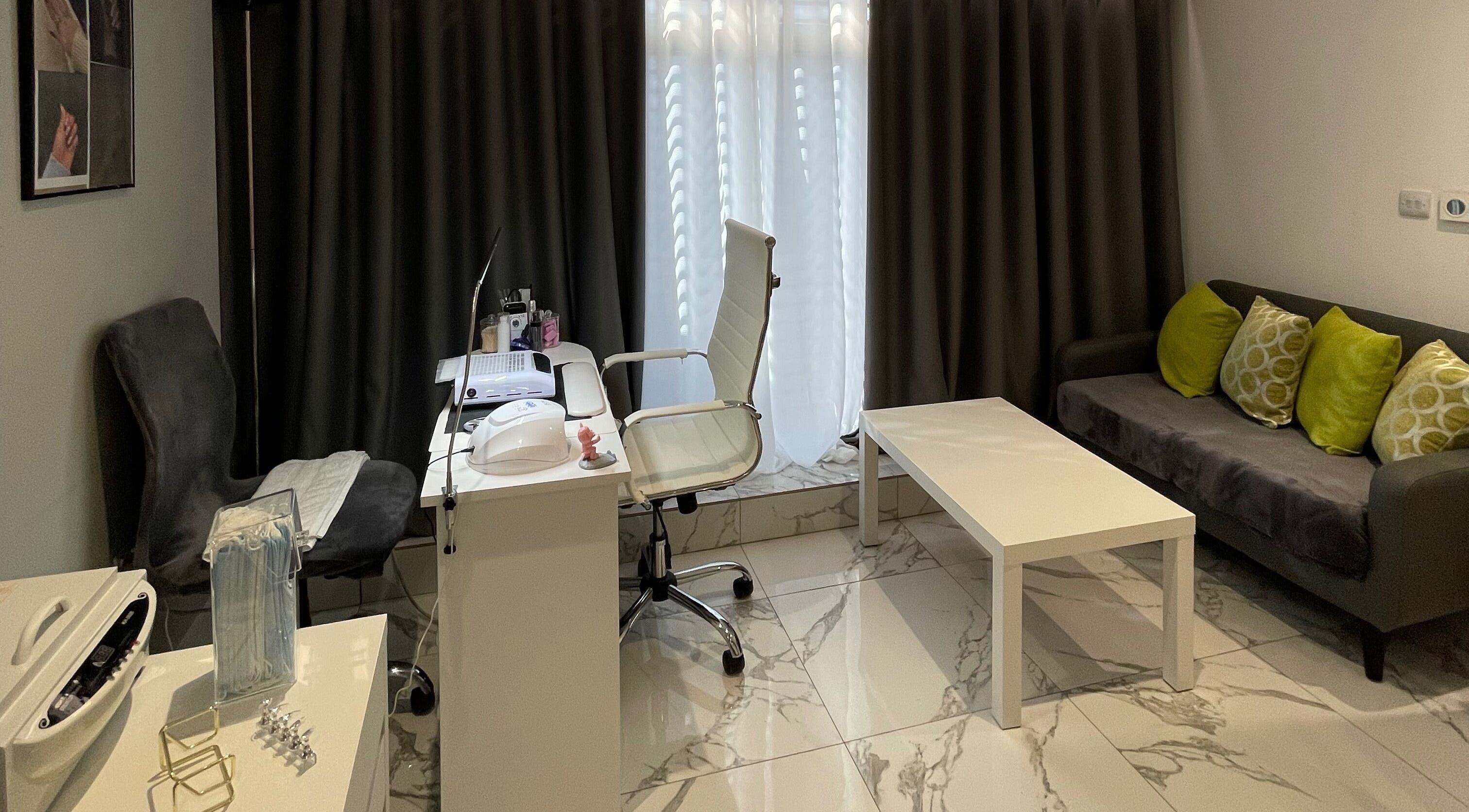 Modern salon setup at The Natural Edit in Chadwell Saint Mary, England featuring stylish decor and plush seating.