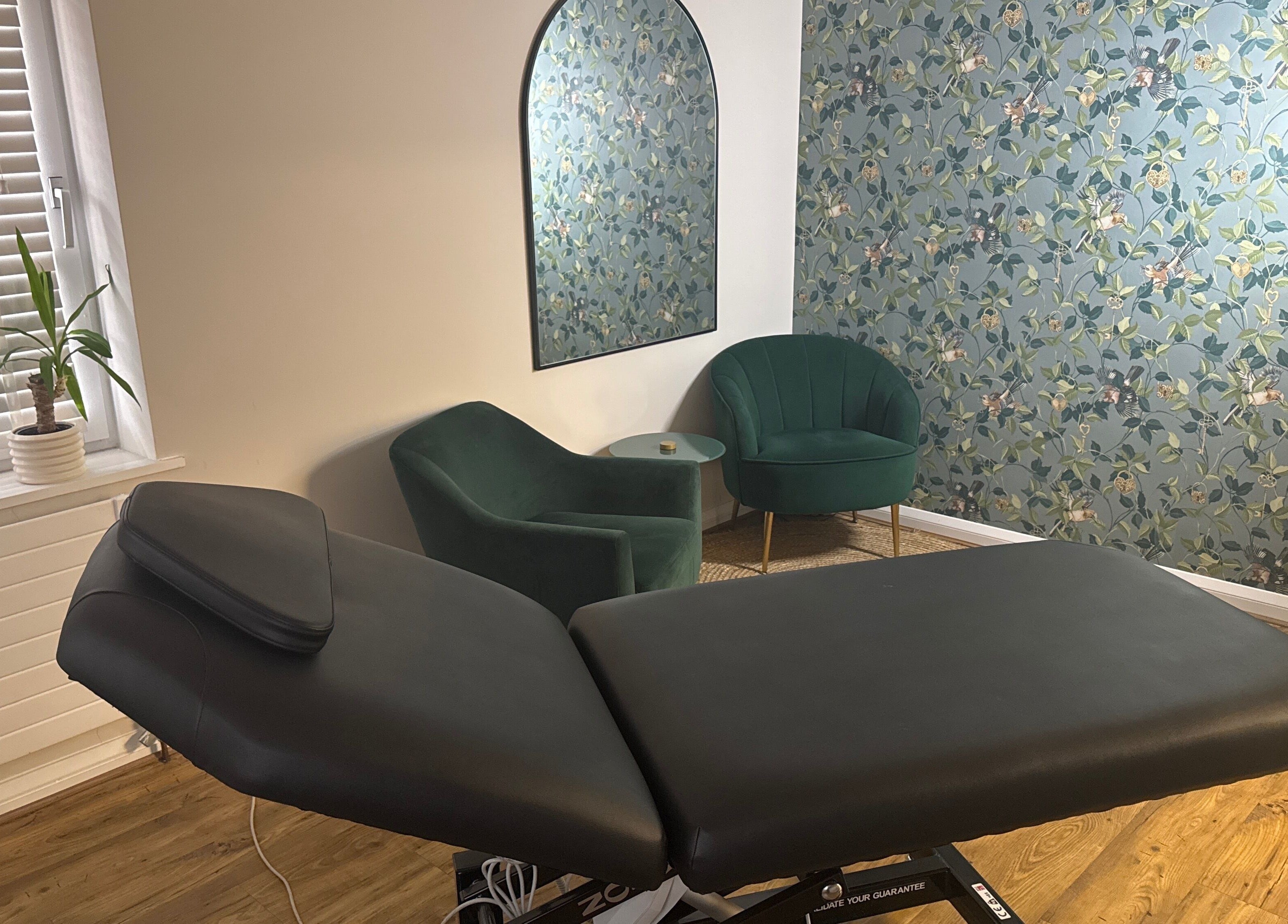 Cozy treatment room at Queen Bee Waxing Studio, Marlow, England, GB with a relaxing ambiance.