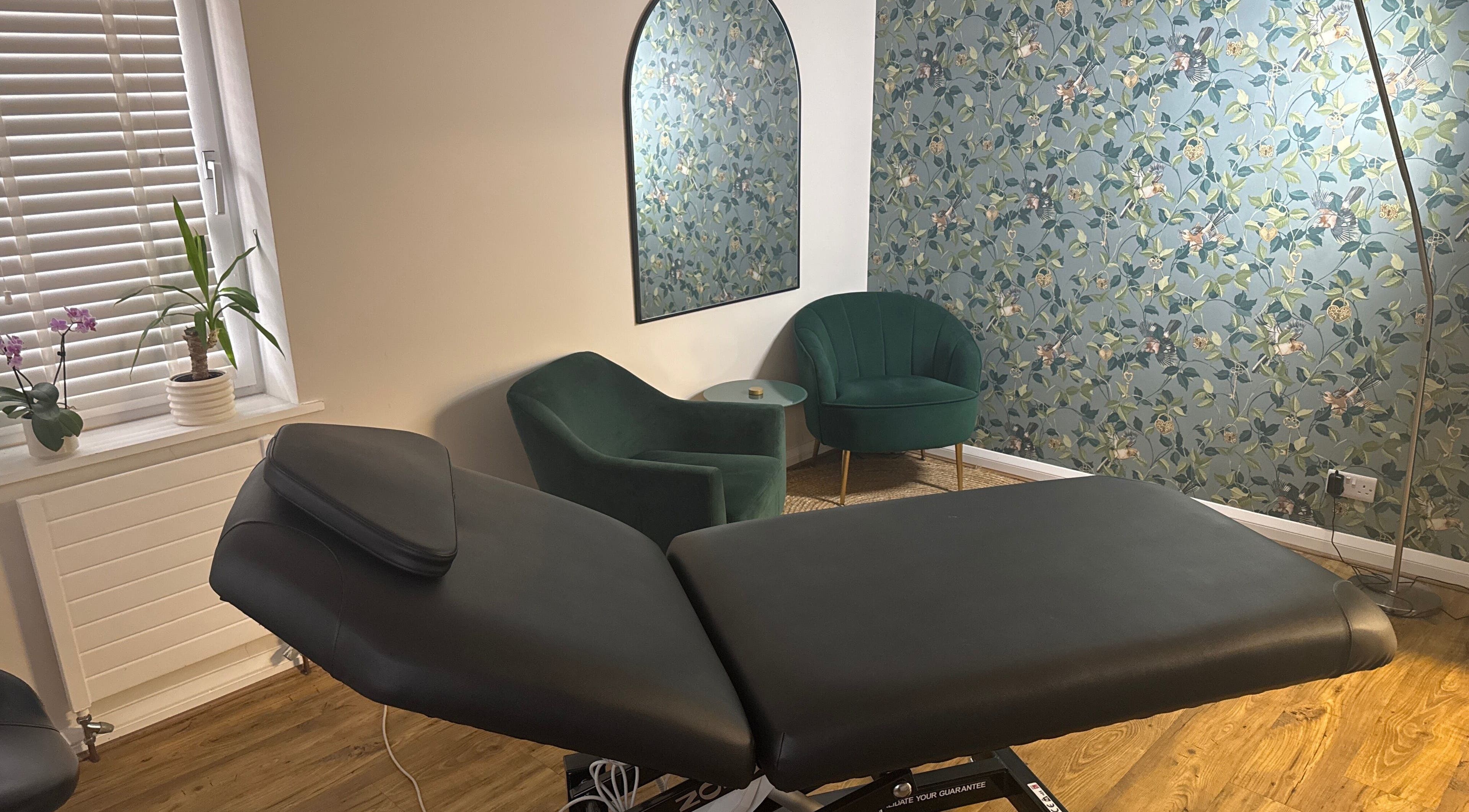 Cozy treatment room at Queen Bee Waxing Studio, Marlow, England, GB with a relaxing ambiance.