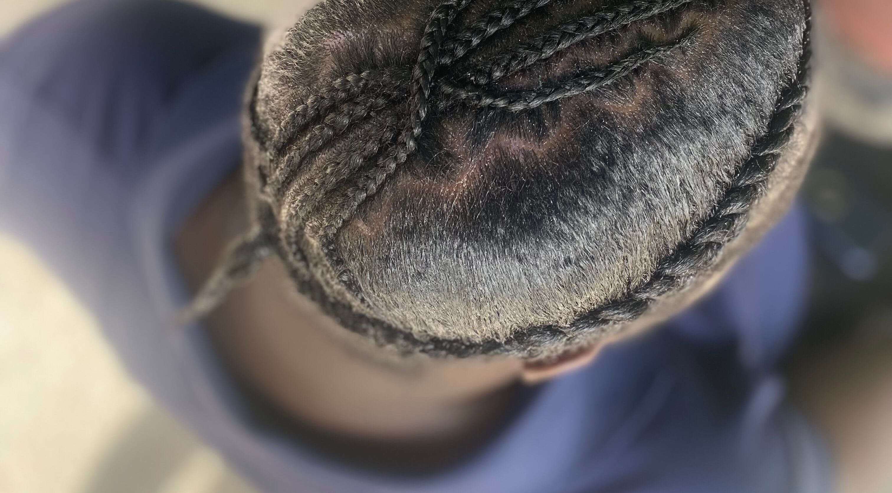 Intricate braided hairstyle showcased at Baby Winx.ent in Eastlynne, Saint George, BB.