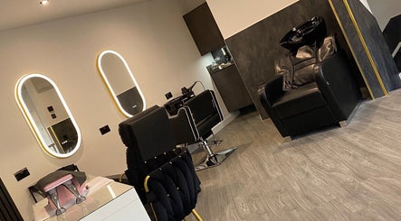 Elegant salon interior at REBEL_LASH_CO in Blackpool, England, GB with modern decor and styling chairs.
