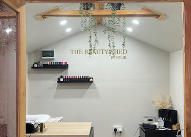 Cozy interior of The Beauty Shed in Shaw, England, GB with elegant decor and beauty products on display.