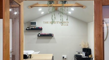 Cozy interior of The Beauty Shed in Shaw, England, GB with elegant decor and beauty products on display.
