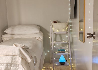 Cozy treatment room at Beautie Wellness in Kuala Lumpur, MY with soft lighting and fresh linens.