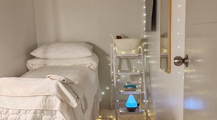 Cozy treatment room at Beautie Wellness in Kuala Lumpur, MY with soft lighting and fresh linens.
