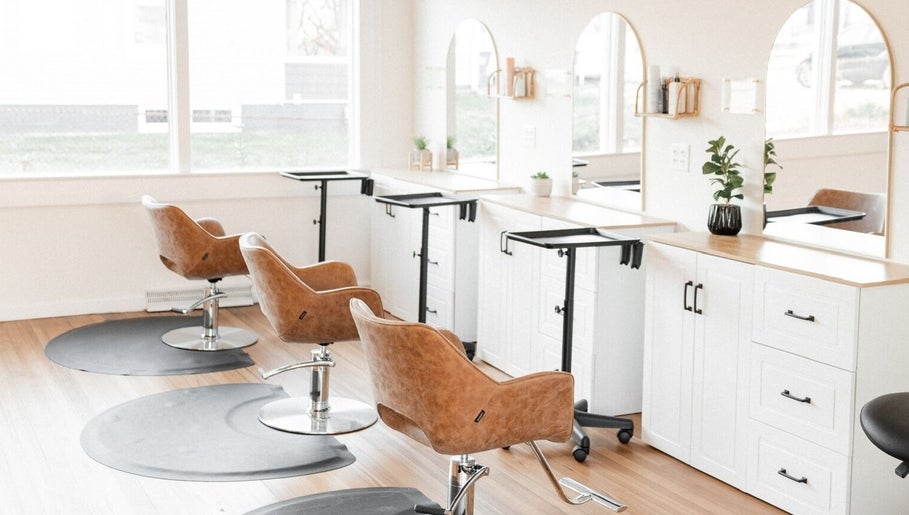 Rosie Atkins Hair salon interior in Winston-Salem, North Carolina, US showcasing stylish chairs and modern decor.