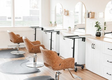 Rosie Atkins Hair salon interior in Winston-Salem, North Carolina, US showcasing stylish chairs and modern decor.