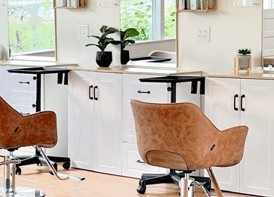 Modern salon chairs at Rosie Atkins Hair, Winston-Salem, North Carolina. Elegant and inviting interior design.