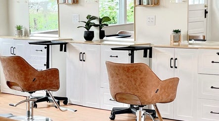 Modern salon chairs at Rosie Atkins Hair, Winston-Salem, North Carolina. Elegant and inviting interior design.