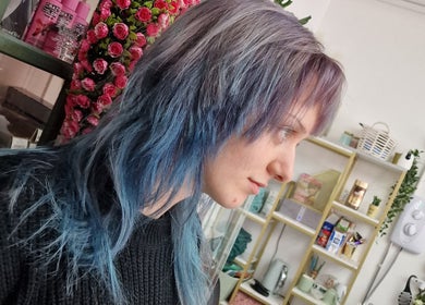 Woman with vibrant blue hair at Stained Beauty Co, Arnold, England, GB.