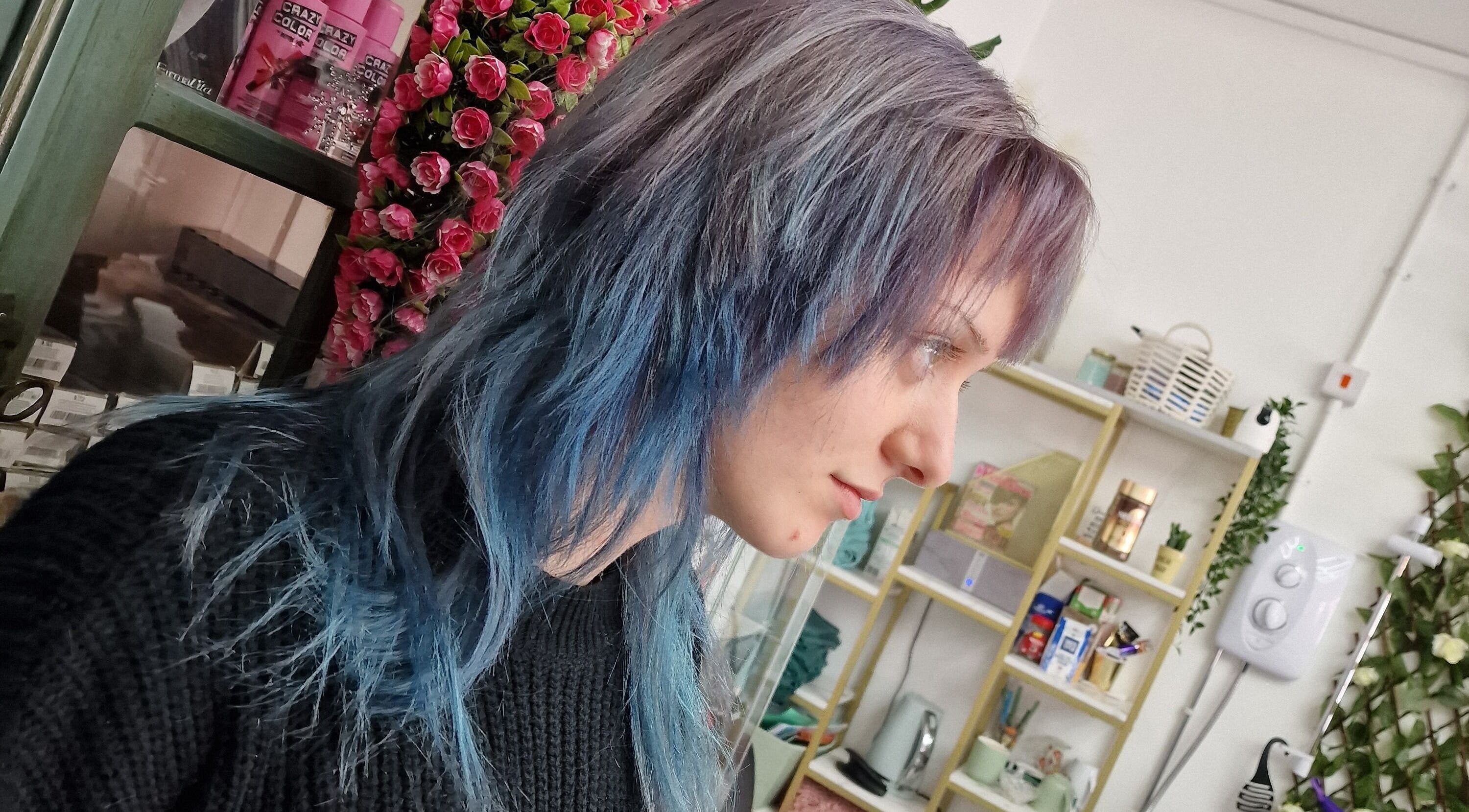 Client with vibrant blue and purple hair at Stained Beauty co, Arnold, England, GB, showcasing unique style.