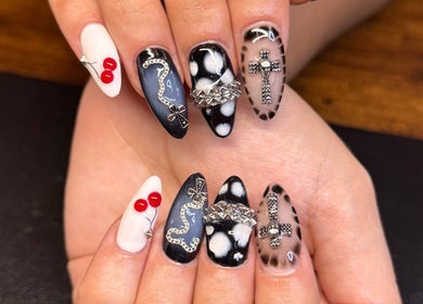 Intricate nail art design by Nailsdonebyisabelle in Vaughan, Ontario, CA featuring bold designs and embellishments.