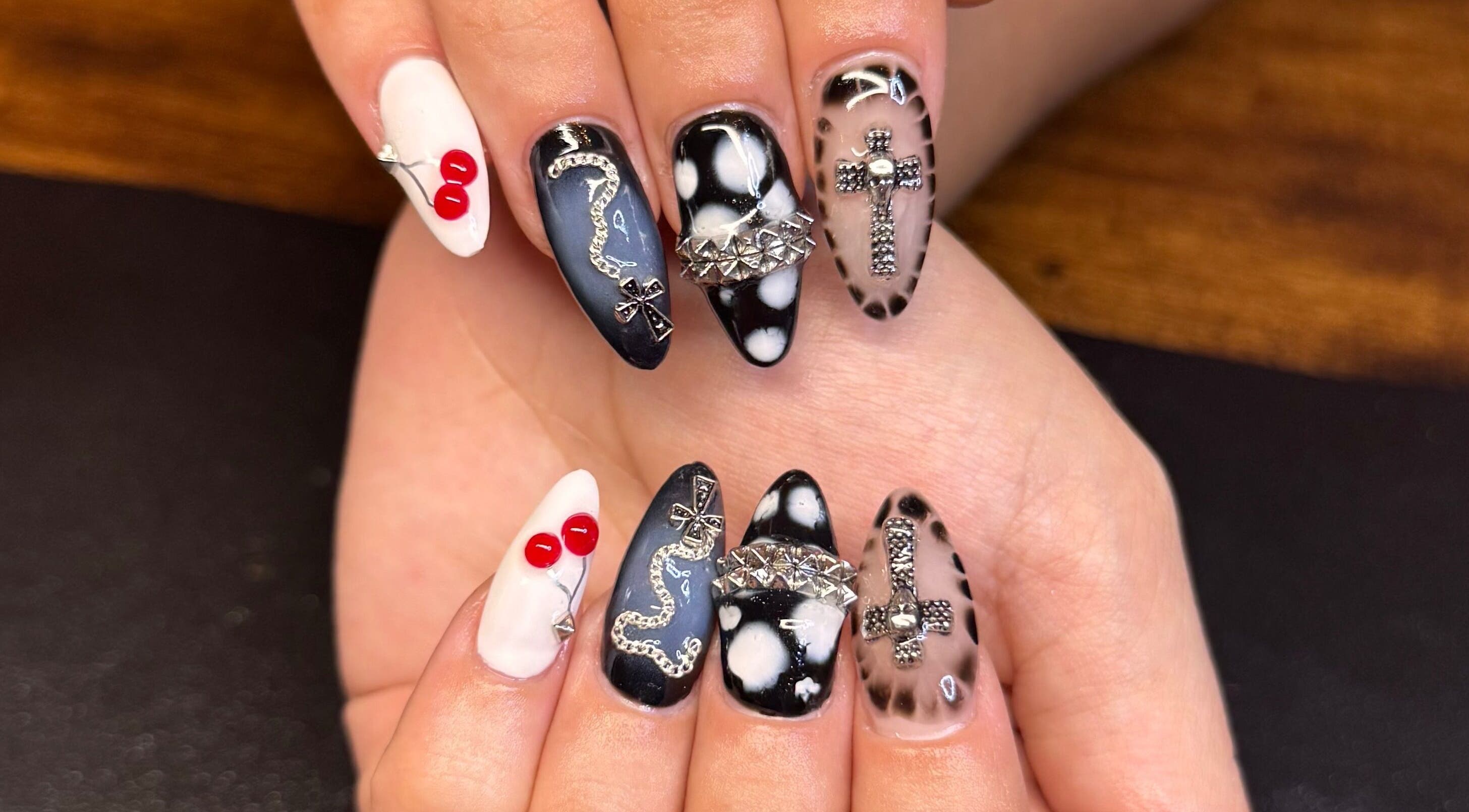 Intricate nail art design by Nailsdonebyisabelle in Vaughan, Ontario, CA featuring bold designs and embellishments.