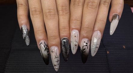 Intricate black and silver nail design at Nailsdonebyisabelle, Vaughan, Ontario, CA.