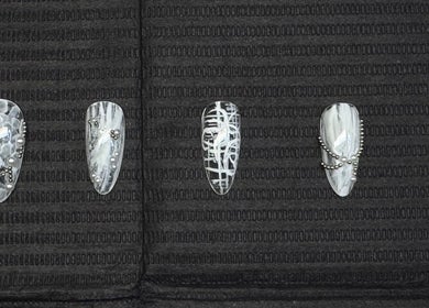 Artistic monochrome nail designs at Nailsdonebyisabelle, Vaughan, Ontario, CA, showcasing intricate patterns.