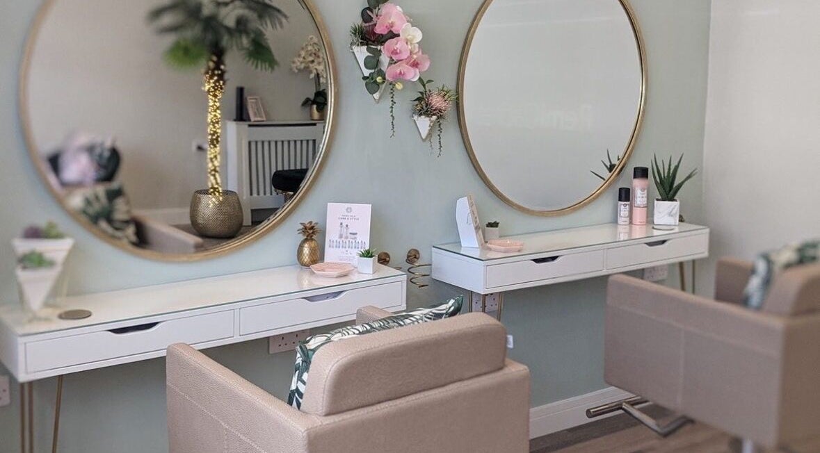 Chic hair styling area at Kayleigh Louise Hair Stylist in Thornton, England, GB with mirrors and decor.