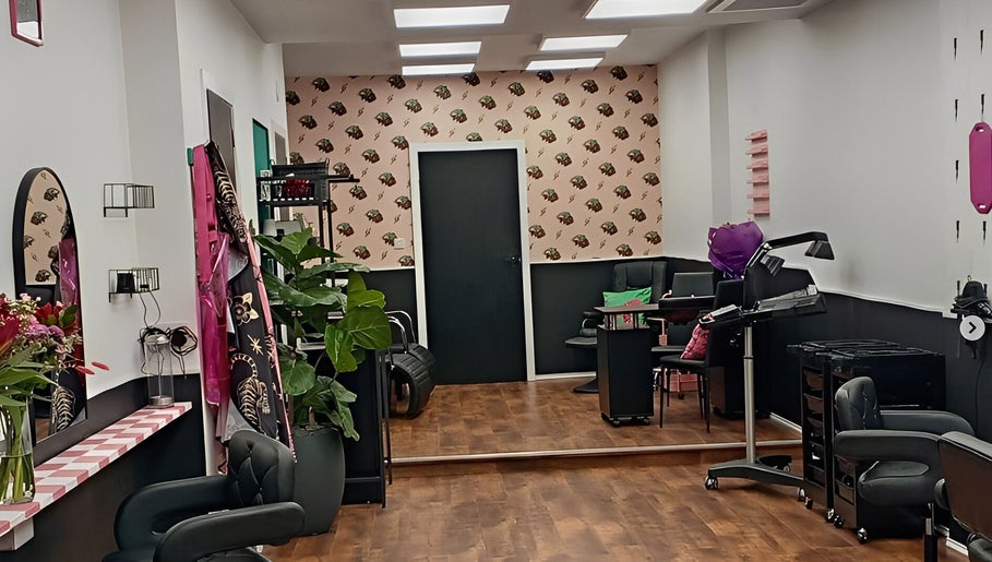 Stylish interior of Hair There Jennifer in Inverness, Scotland, GB showcasing modern salon chairs and decor.