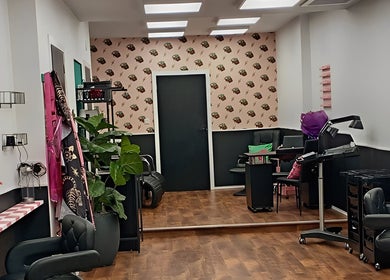 Stylish interior of Hair There Jennifer in Inverness, Scotland, GB showcasing modern salon chairs and decor.